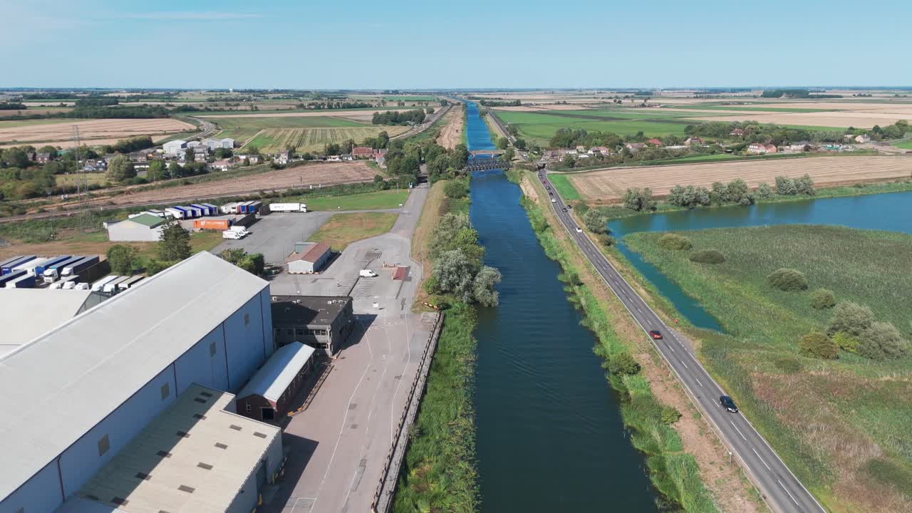 Aerial view of river and quarries under clear blue skies