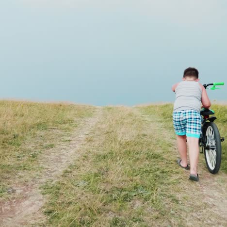 two children drive their bikes up the hill 1