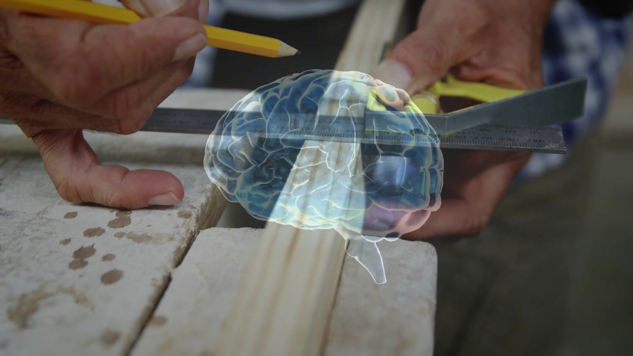 Carpenter hands moving to trim squaring with yellow pencil marking line as brain overlay drifting