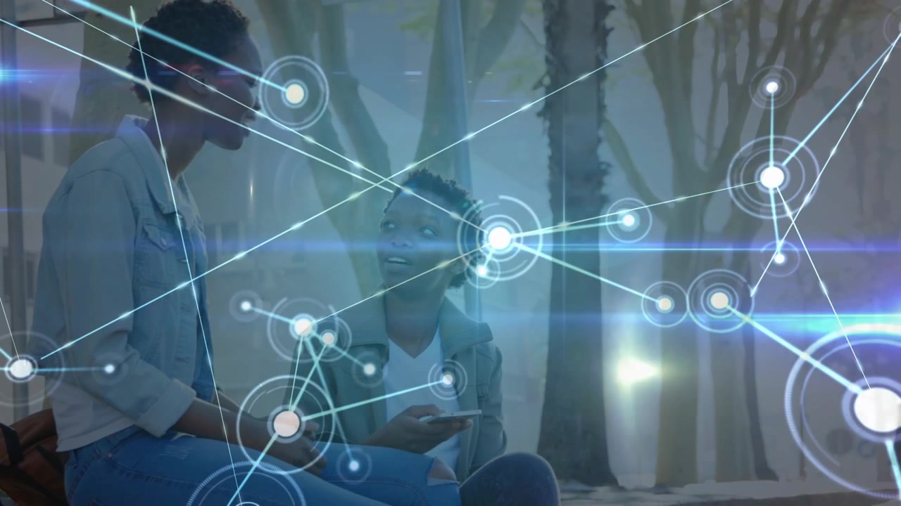 Animation of connections over happy african american female friends with smartphones