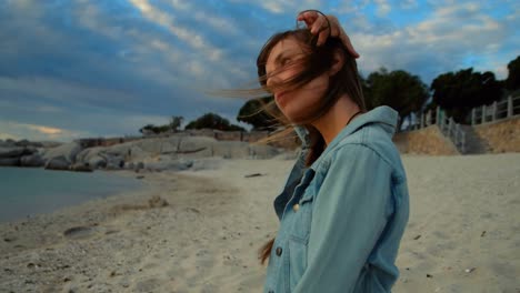 woman sitting on beach 4k