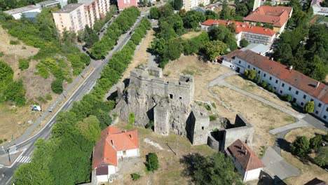 revealing drone establishing shot of levice castle, ancient hrad in slovakia