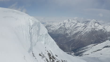 stunning aerial footage of glaciers in saas-fee and zermatt, showcasing ice formations, crevasses, seracs, and the dramatic impact of global warming on these majestic alpine landscapes.