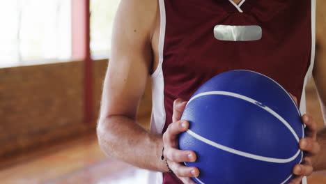 determined basketball player holding a basketball