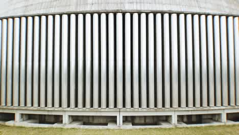 Very-close-upwards-Drone-flight-along-the-concrete-structure-of-a-cooling-tower-of-a-coal-power-plant-in-Europe