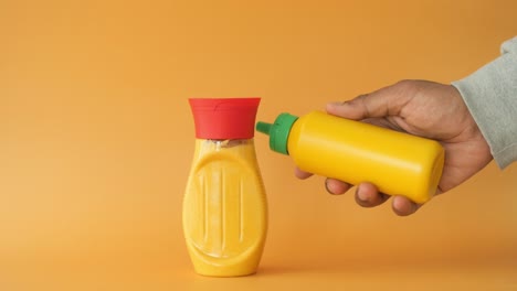 mustard bottle in hand