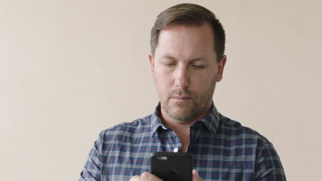 portrait of casual businessman working on phone texting