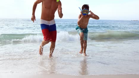 Father-and-son-having-fun-with-waves