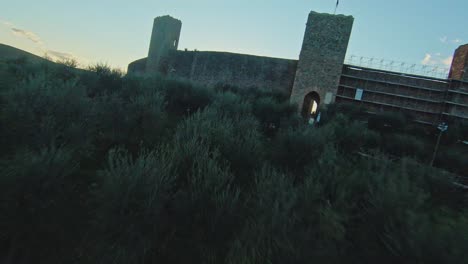 fast aerial over the commune of monteriggioni at sunset, province of siena, italy