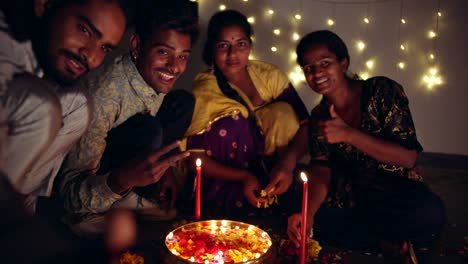 friends family decoarting for hindu festival of diwali