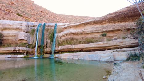 a waterfall in the middle of the sahara desert algeria biskra