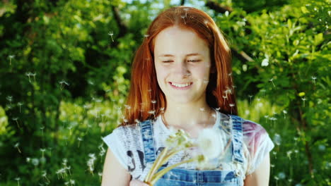 a girl with bright red hair has fun playing with dandelion flowers 3