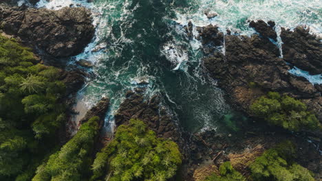 Drone-video-at-sunset-in-Ucluelet-British-Columbia,-Canada-over-the-ocean-and-forest