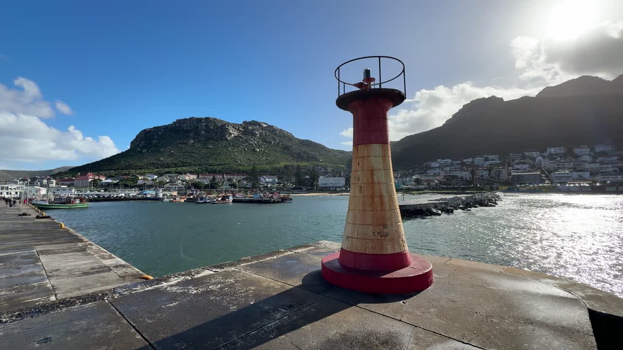 Lighthouse at the edge of the pier in Kalk Bay, near Cape Town.
