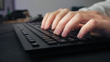 Closeup-of-a-male-gamer-writing-on-the-keyboard