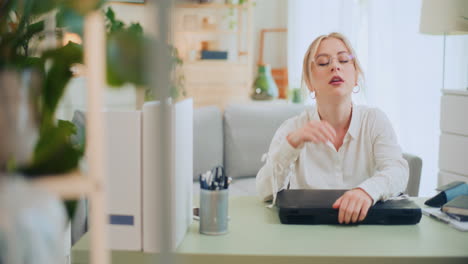 overworked girl closes laptop