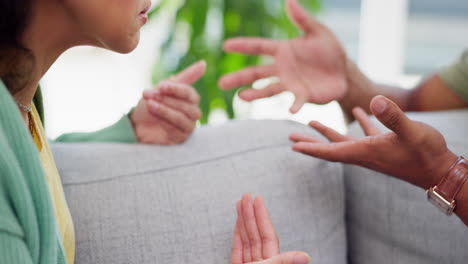 Hands,-fight-and-couple-on-a-sofa-for-argument