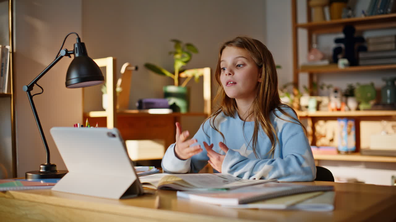 Girl working online lesson answering question looking tablet home closeup