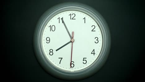 clock isolated on black background, showtime 07.55 am or pm.