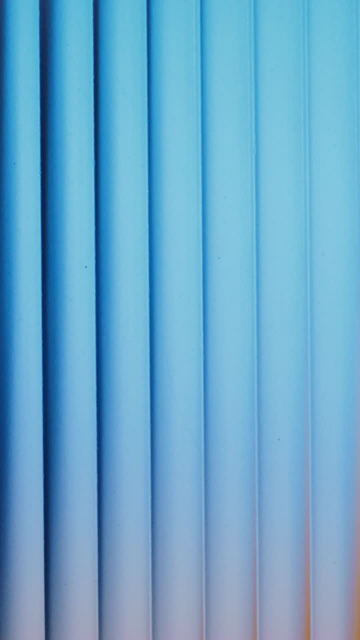 Close-up of a light blue vertical panelled surface
