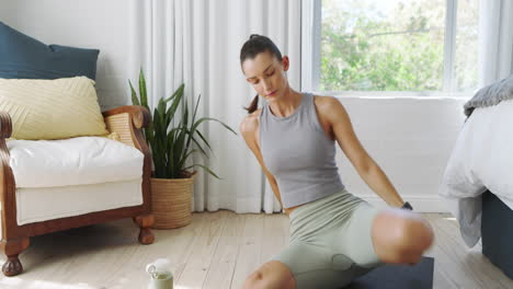 woman stretching on yoga mat at home, focusing on flexibility and wellness