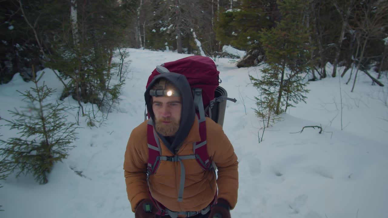Man with Headlamp Hiking in Evening
