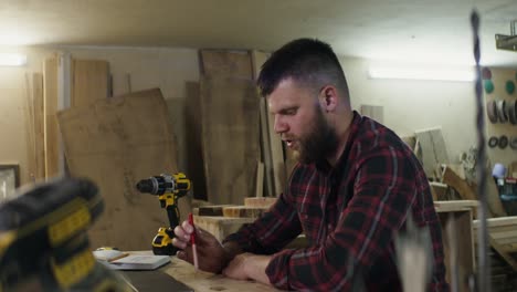 woodworker working on a woodworking project in a workshop