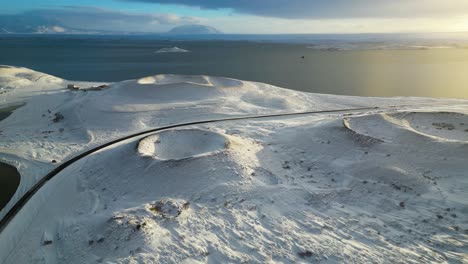 volcanic iceland craters during snowy winter sunset - aerial drone view