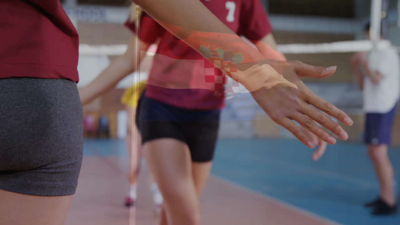 Playing volleyball, athletes on court with Croatian flag animation overlay