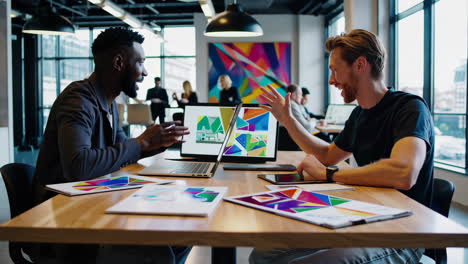 business colleagues collaborating on creative design in a modern office