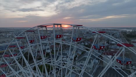 ocean city, new jersey ferris wheel lit by setting sun