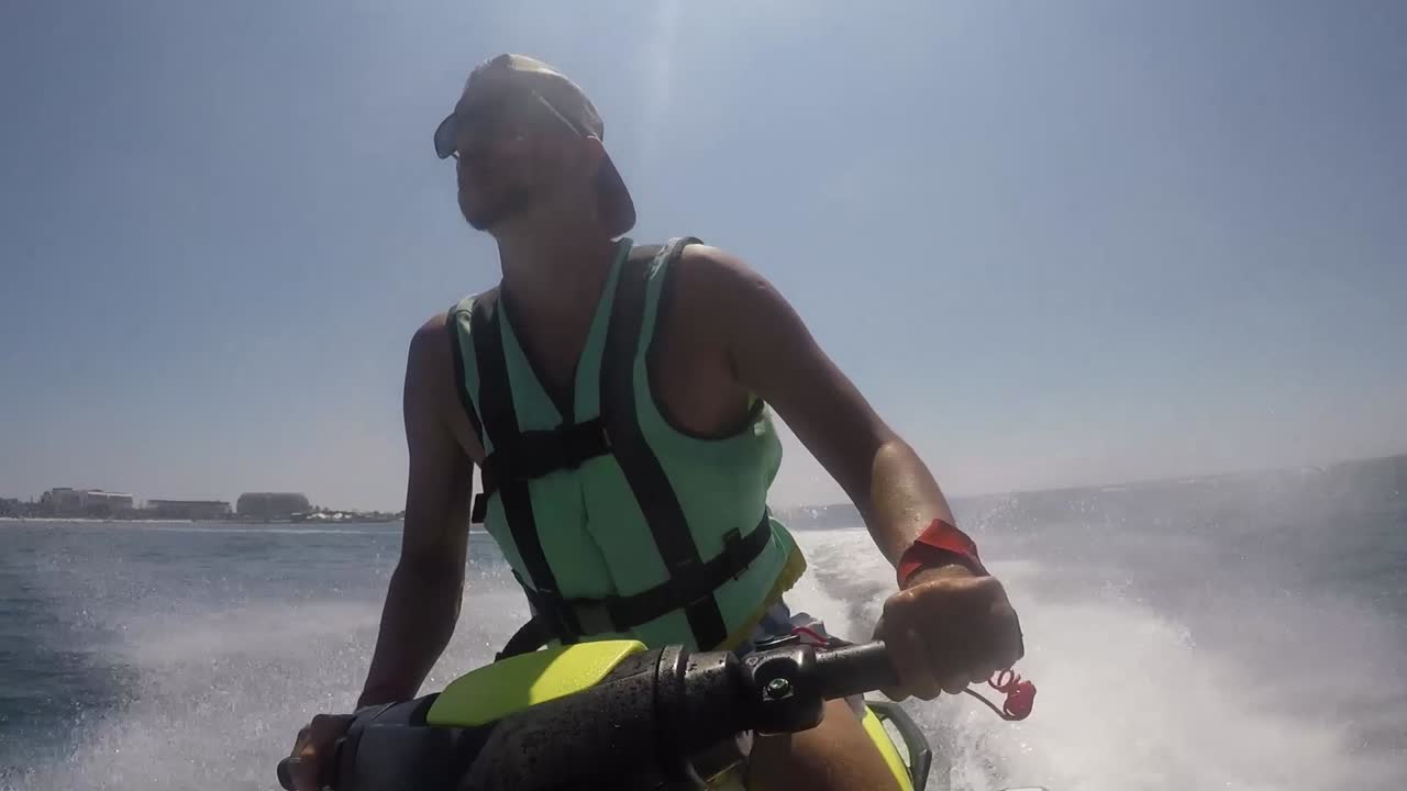 Man riding a jet ski on the sea