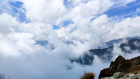 heavy cloud movements with himalayan mountain background at morning from flat angle video is taken at sela pass tawang india