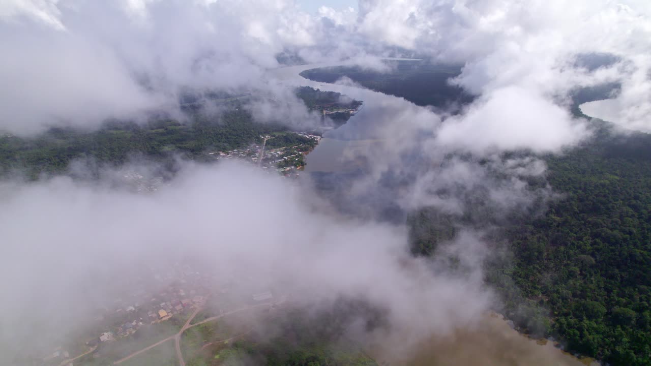 Clouds view of rural residential area alongside the river, South America, Suriname