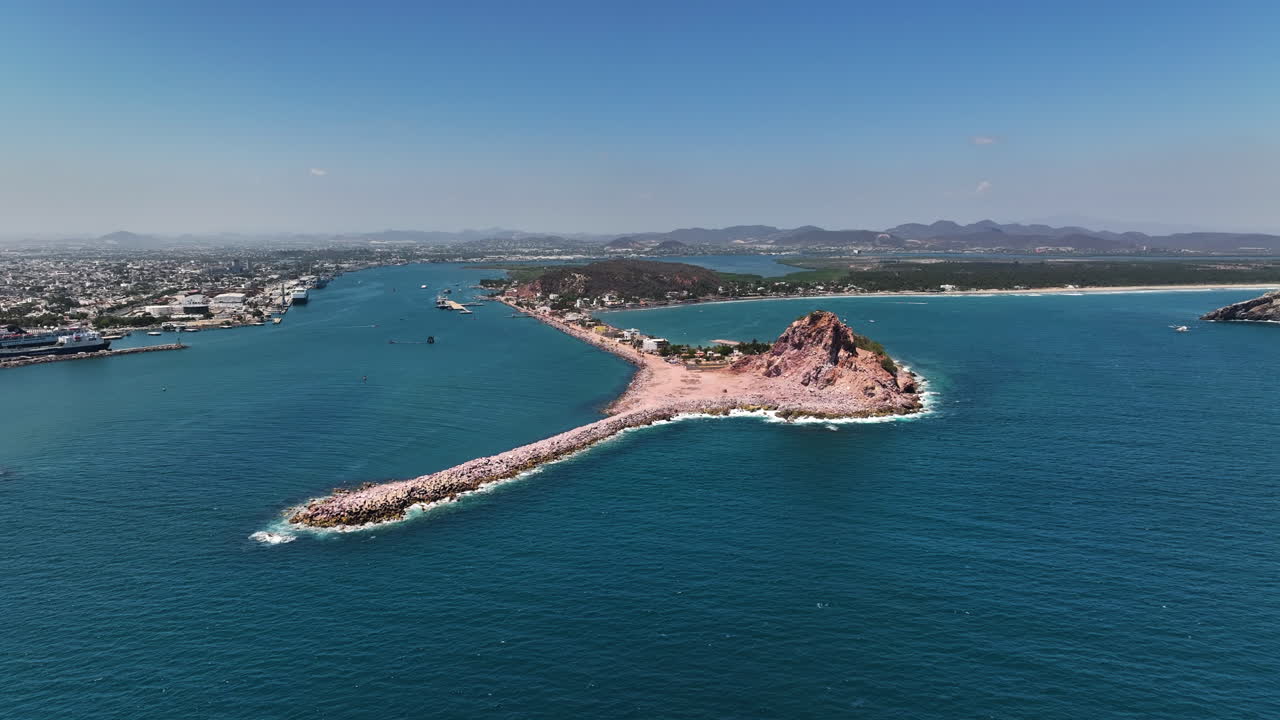 Aerial view approaching the Isla de La Piedra island in sunny Mazatlan, Mexico