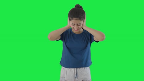 Indian-teenage-girl-getting-frustrated-by-loud-noises-Green-screen