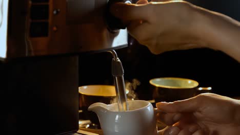 Steaming-milk-at-coffee-machine-4k