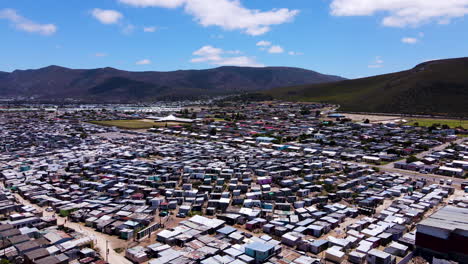 Unregulated-housing-in-coastal-township,-urban-sprawl---aerial-view