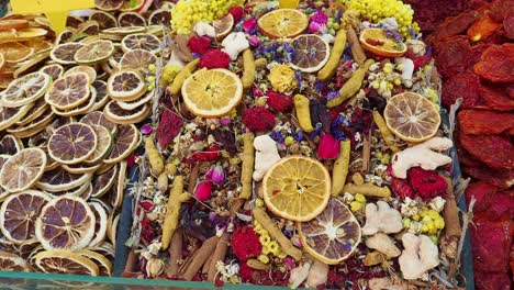 dried fruits, herbs, and spices at a market stall