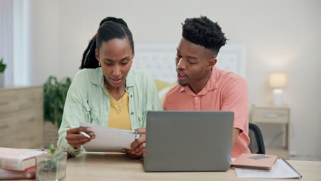 Couple,-laptop-and-document-for-home-budget