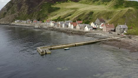 aerial view of the crovie village on the aberdeenshire coastline on an overcast summer evening