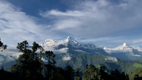 timelapse of annapurna south and the range with moving clouds