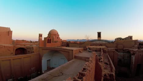 static time lapse old historical yazd city old town rooftop with wind catchers panoramic view at sunset with no people