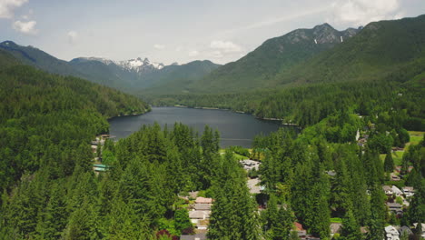 descending aerial view of spectacular capilano lake in north vancouver, british columbia