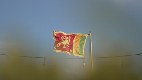 a flag os sri lanka flying in the wind