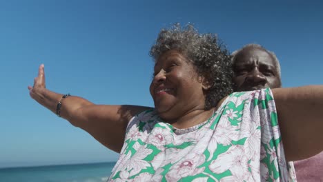 Senior-couple-enjoying-free-time-at-the-beach