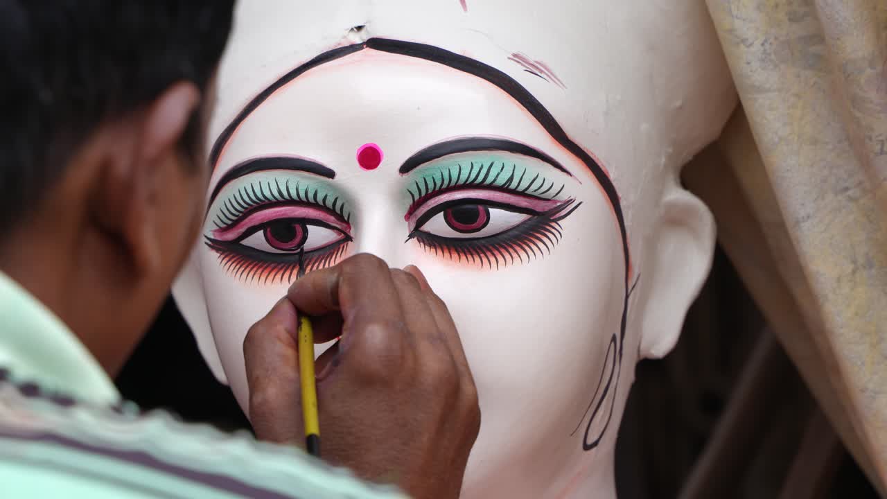 Artist Painting a Durga Statue for an Indian Festival