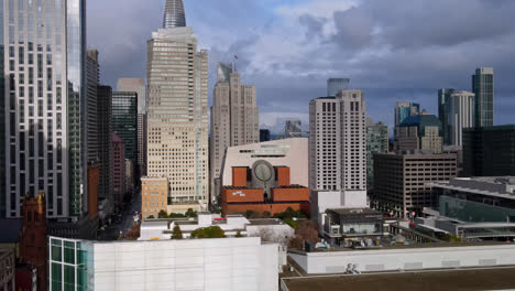 drone shot revealing union square skyline buildings, san francisco city skyline, financial district at sunset