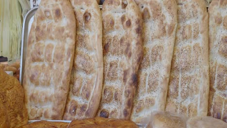 closeup of freshly baked flatbreads in a bakery