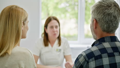 couple meeting with doctor